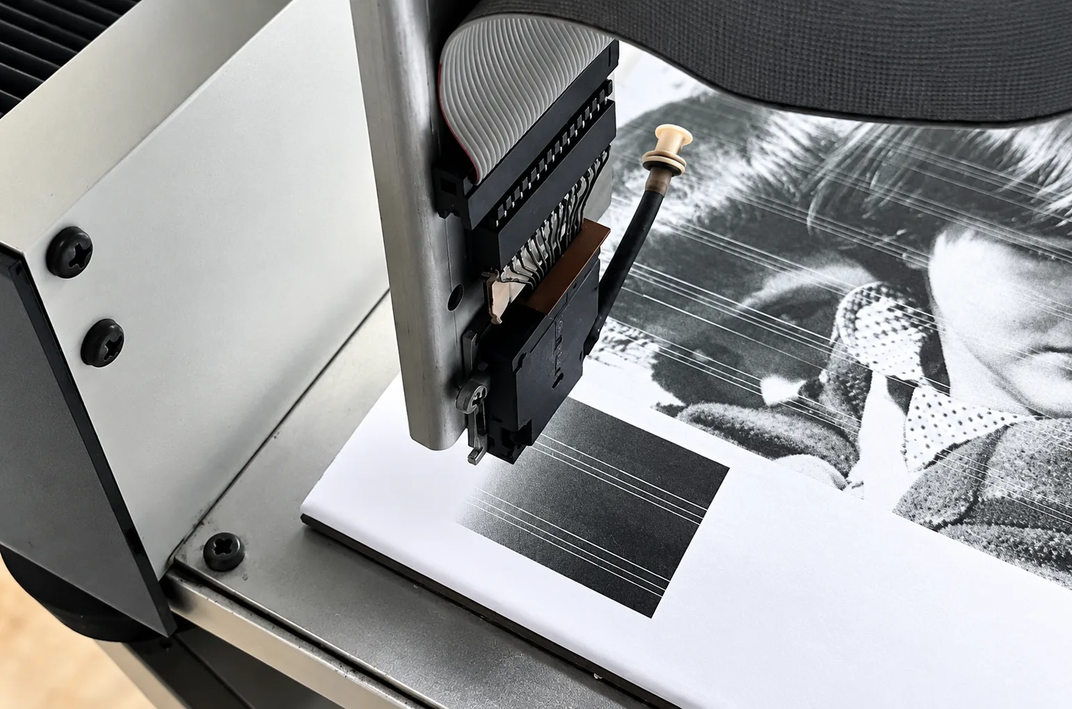 Printhead of KERAjet's first prototype printing on a ceramic tile